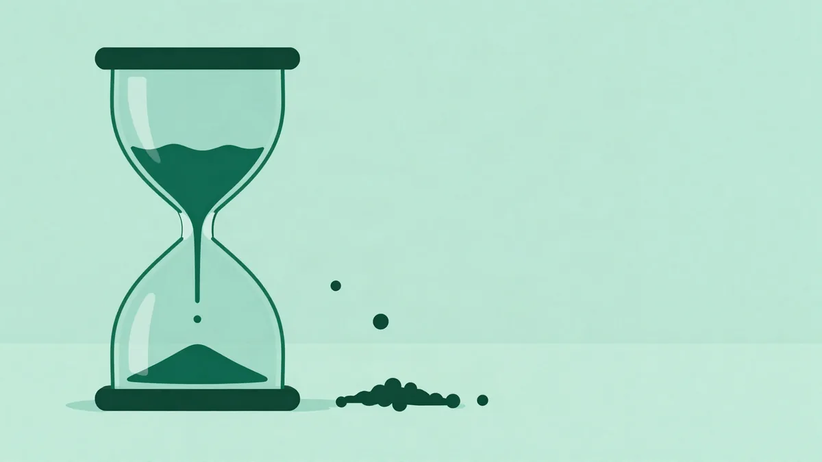 Flat illustration of a tilted hourglass with small spheres falling slowly through the narrow neck, a few still suspended above it and a small pile collected below