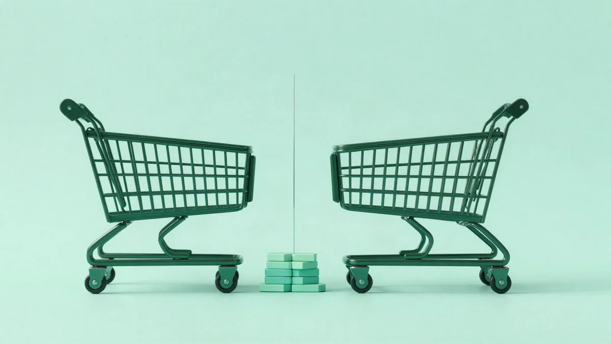 Illustration of two identical shopping carts facing each other across a thin vertical divider, with a small stack of layered blocks between them